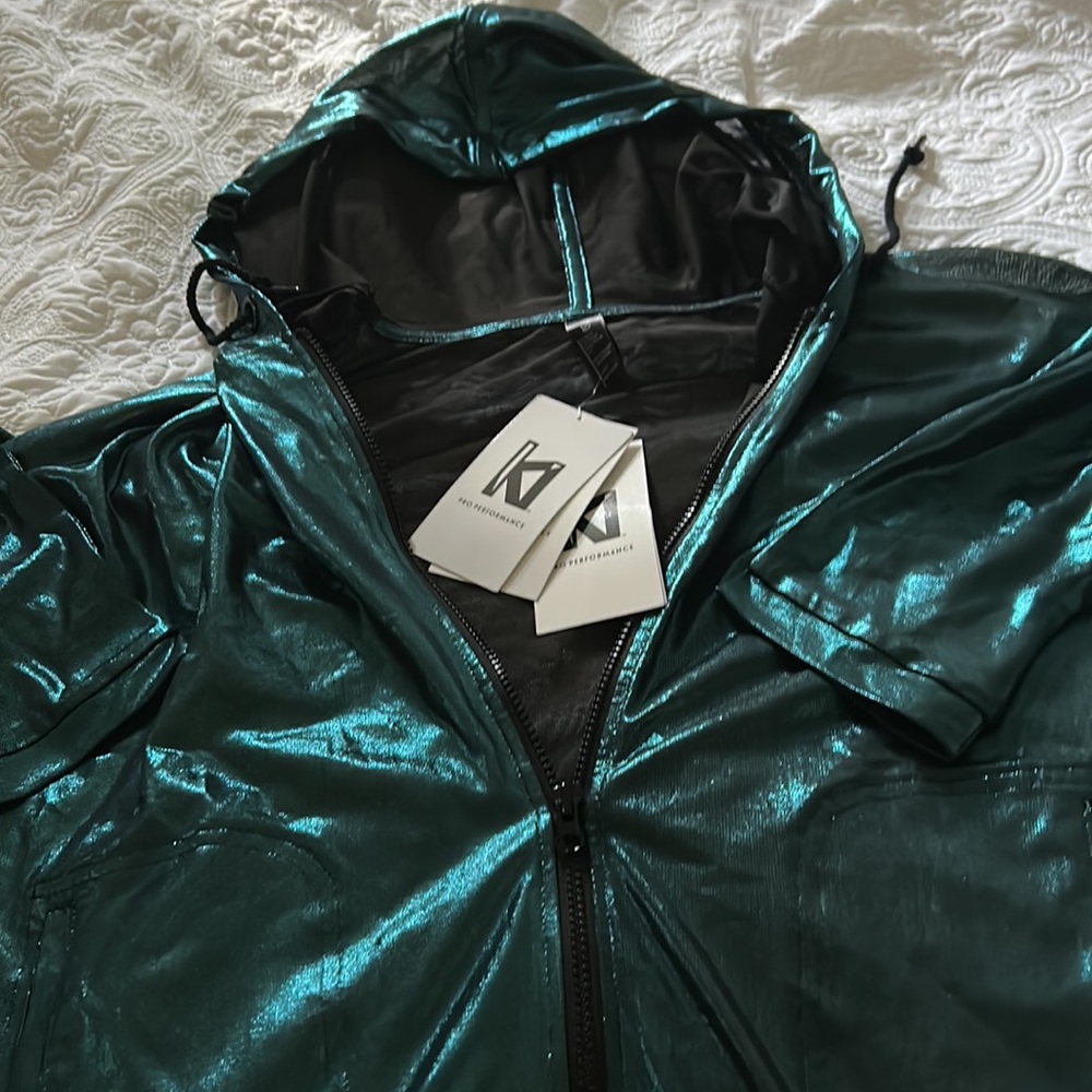 Famous brand KI  Sheer teal shimmery hooded zip up jacket size small NWT LOOK